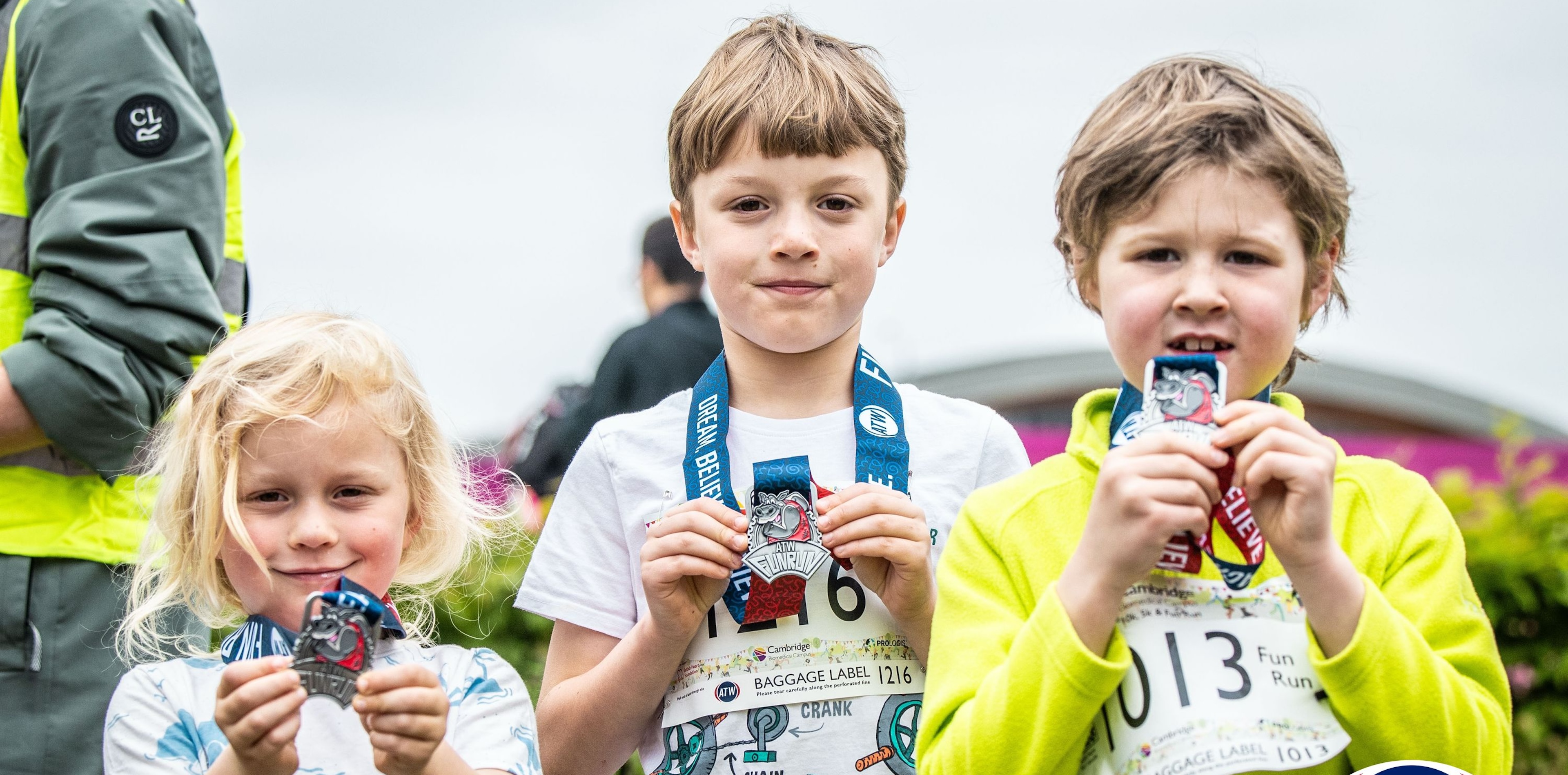 Children showing their CBC Fun Run medals