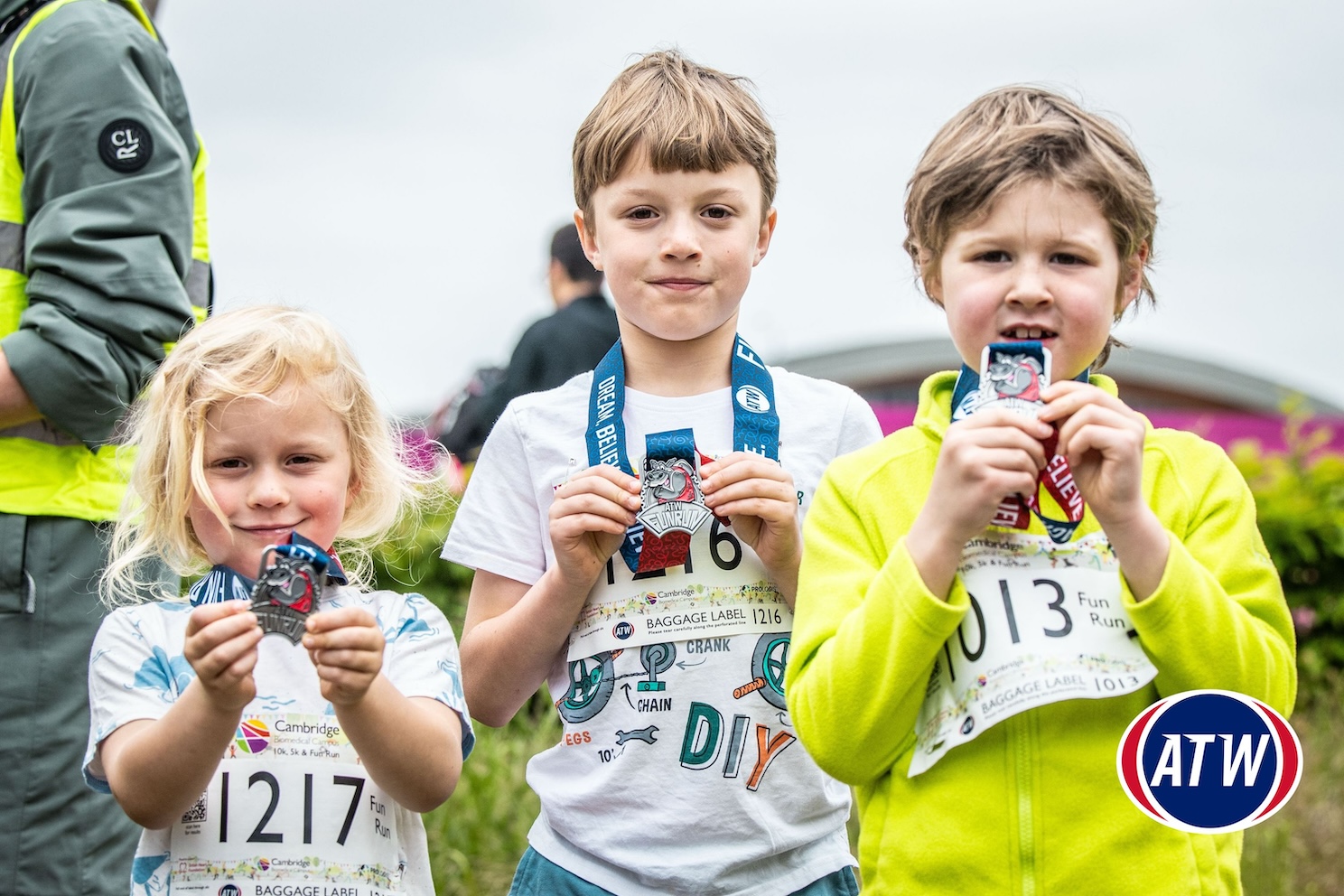 Children showing their CBC Fun Run medals