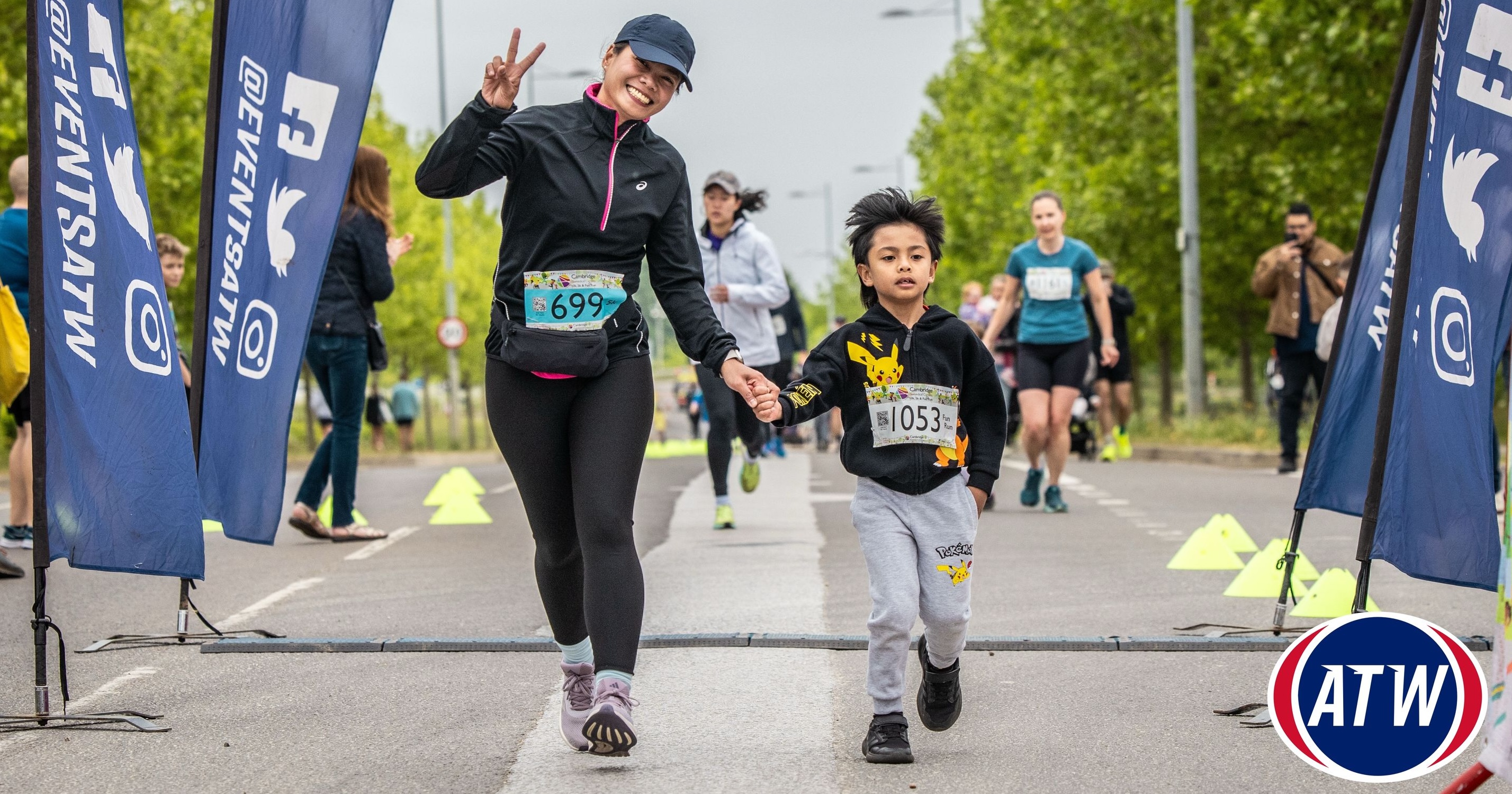 Woman and child taking part in the Cambridge Biomedical Campus Fun Run