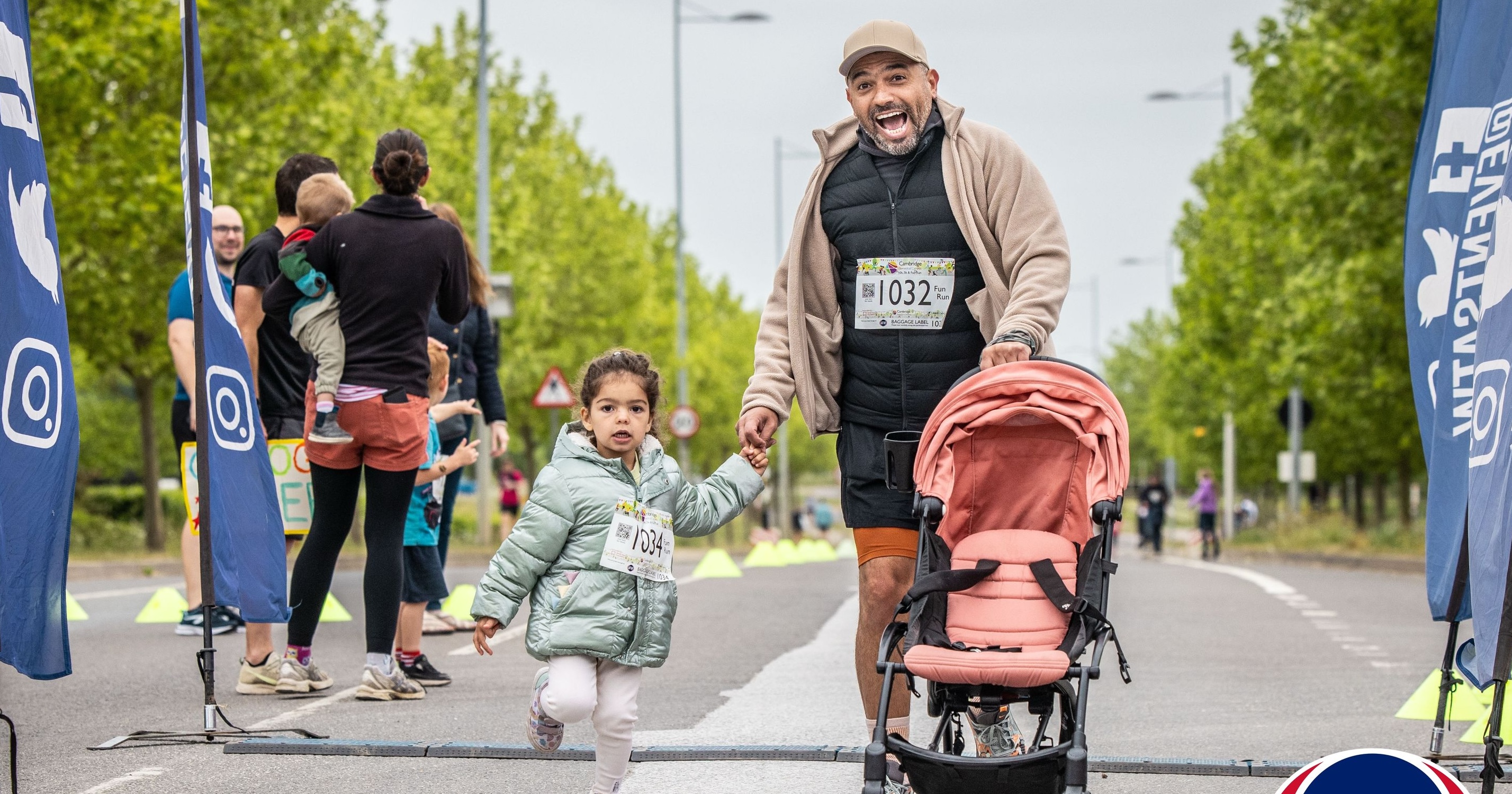 Man and child taking part in the Cambridge Biomedical Campus Fun Run