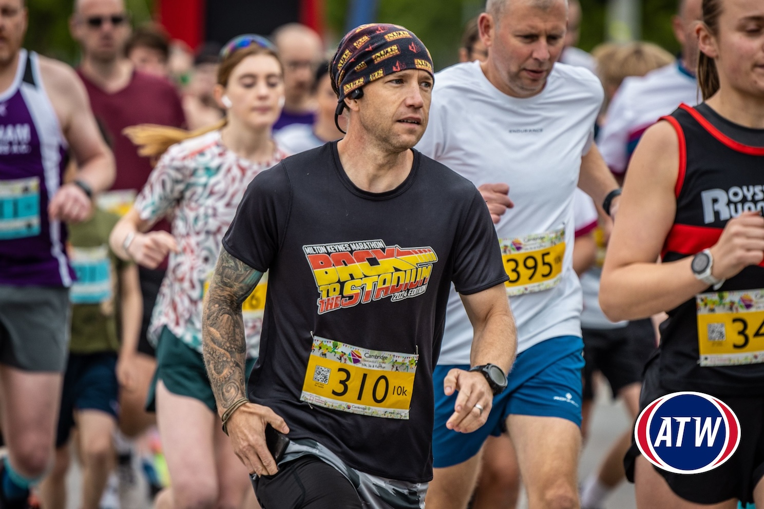 Man running in the Cambridge Biomedical Campus Fun Run