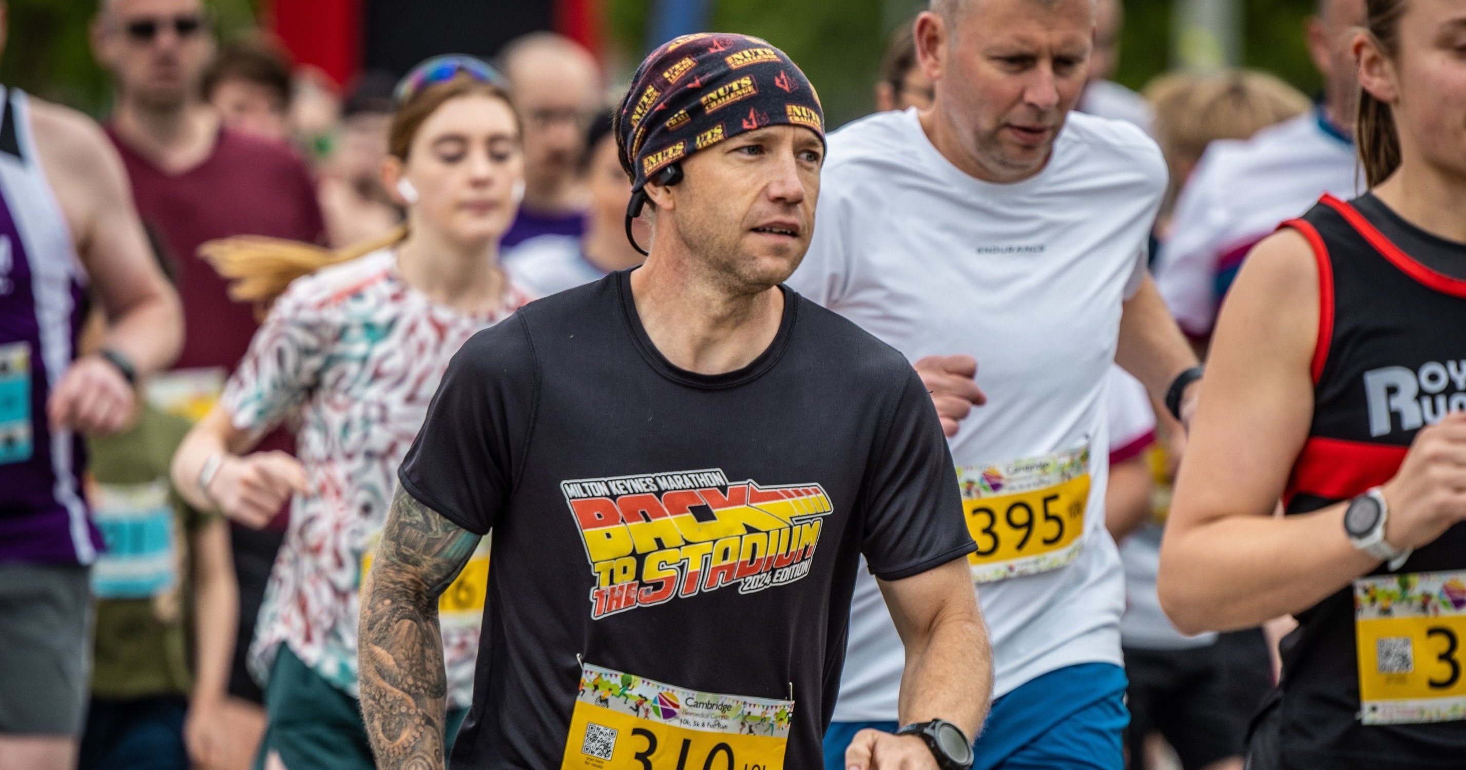 Man running in the Cambridge Biomedical Campus Fun Run